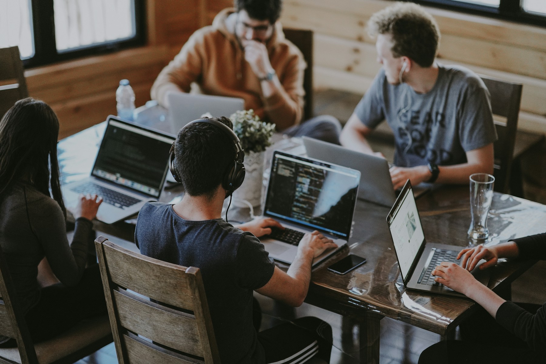 People working together around laptops